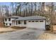 Lovely home with a two-car garage and a well-manicured front yard at 2490 Brookcliff Ne Way, Atlanta, GA 30345