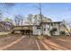 The rear of the home features a large deck, fenced yard and mature trees at 2490 Brookcliff Ne Way, Atlanta, GA 30345