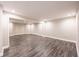 Spacious finished basement with neutral walls, modern trim, and stylish floors at 557 Old Friar Tuck Ln, Stone Mountain, GA 30087