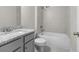 Well-lit bathroom showcasing vanity, granite counters, tiled shower and tub combination at 2020 Manor Pointe Dr, Cumming, GA 30041