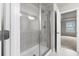 Clean bathroom highlighting tiled shower with glass door and view to an adjacent room at 2020 Manor Pointe Dr, Cumming, GA 30041