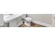 Compact bathroom featuring a pedestal sink and modern toilet on new floor at 2020 Manor Pointe Dr, Cumming, GA 30041