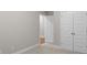 Bedroom boasts a neutral carpet, trim, and a double door closet for ample storage at 2020 Manor Pointe Dr, Cumming, GA 30041
