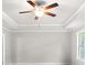 Bedroom boasts trey ceiling, neutral walls, carpet and a ceiling fan at 2020 Manor Pointe Dr, Cumming, GA 30041