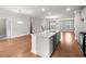 Open kitchen with a large island, stainless steel appliances, and hardwood floors at 2020 Manor Pointe Dr, Cumming, GA 30041