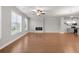 Inviting living area showcasing hardwood floors, ample natural light, a modern fireplace, and an open layout to the kitchen at 2020 Manor Pointe Dr, Cumming, GA 30041