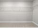 Spacious walk-in closet with ample storage solutions and carpeted flooring at 2020 Manor Pointe Dr, Cumming, GA 30041