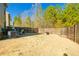Large, well-kept backyard enclosed by a fence with patio seating, perfect for outdoor activities and privacy at 375 Milton Dr, Covington, GA 30016
