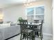 Dining area with a wooden table set next to the living room and windows at 375 Milton Dr, Covington, GA 30016