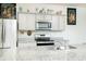 Well-equipped kitchen featuring stainless steel appliances, granite countertops, and ample cabinet space for storage at 375 Milton Dr, Covington, GA 30016