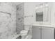 Bathroom featuring marble-tiled shower, a modern vanity, and fixtures at 7155 Pineneedle Drive Sw, Covington, GA 30016
