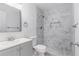 Bathroom featuring marble-tiled shower and floor, plus a modern vanity at 7155 Pineneedle Drive Sw, Covington, GA 30016