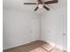 Bedroom featuring light-colored wood look floors, a ceiling fan, and white doors at 7155 Pineneedle Drive Sw, Covington, GA 30016