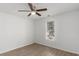 Bedroom featuring a ceiling fan, a window letting in natural light, and wood-look flooring at 7155 Pineneedle Drive Sw, Covington, GA 30016