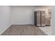 Open layout featuring vinyl flooring, stainless steel appliances, and white cabinets at 7155 Pineneedle Drive Sw, Covington, GA 30016