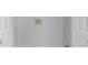 A clean laundry room with white walls, and hookups for a washing machine at 7155 Pineneedle Drive Sw, Covington, GA 30016