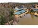 Aerial view of community tennis courts next to a lake on a sunny day at 825 Autry Landing Cir, Alpharetta, GA 30022