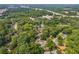 This aerial view captures the home's location near a green suburban area and a major highway at 2825 3Rd Sw Ave, Atlanta, GA 30315