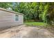 Backyard features a concrete patio area next to the home, with a glimpse of the wooden fence at 2825 3Rd Sw Ave, Atlanta, GA 30315