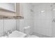 Modern bathroom featuring tiled walls, a new vanity, and updated fixtures at 2825 3Rd Sw Ave, Atlanta, GA 30315