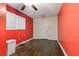 A bedroom showcases dark wood floors, red walls and natural light from the window at 2825 3Rd Sw Ave, Atlanta, GA 30315