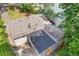 An aerial view of a home's exterior with gray siding and a new roof with mature landscaping at 2825 3Rd Sw Ave, Atlanta, GA 30315