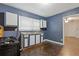 Kitchen with dark blue walls, stainless steel appliances, hardwood floors and ample light at 2825 3Rd Sw Ave, Atlanta, GA 30315