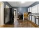 Spacious kitchen featuring stainless steel appliances, hardwood floors, and painted blue walls at 2825 3Rd Sw Ave, Atlanta, GA 30315