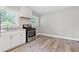 Bright kitchen featuring white cabinets, hardwood flooring, and modern stainless steel appliances at 2825 3Rd Sw Ave, Atlanta, GA 30315