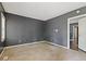A gray-painted living room features neutral carpet and a doorway leading to additional rooms at 2825 3Rd Sw Ave, Atlanta, GA 30315