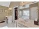 Bright bathroom with double vanities and separate tub at 155 Matthew Way, Fayetteville, GA 30214
