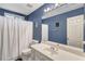 Full bathroom features a white vanity and shower-tub combination at 155 Matthew Way, Fayetteville, GA 30214