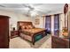 Comfortable bedroom with queen bed, carpet, and natural lighting at 155 Matthew Way, Fayetteville, GA 30214