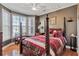 Primary bedroom has a sitting area, hardwood flooring and neutral wall paint at 155 Matthew Way, Fayetteville, GA 30214