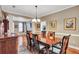 Traditional dining room with wood table, chandelier, and detailed molding at 155 Matthew Way, Fayetteville, GA 30214