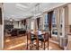 Open floor plan integrates dining area with windows and hardwood floors for natural light at 155 Matthew Way, Fayetteville, GA 30214