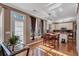 Bright eat-in kitchen and bar area with hardwood floors, a breakfast table and sun-drenched windows at 155 Matthew Way, Fayetteville, GA 30214