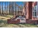 Inviting brick patio featuring an outdoor dining area with a pergola, perfect for entertaining and relaxation at 155 Matthew Way, Fayetteville, GA 30214