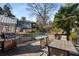 Backyard deck features a barbecue and patio set for outdoor dining overlooking the pool at 166 Erie Ave, Decatur, GA 30030