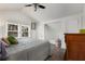 Attic bedroom with sloped ceilings, dormer windows, and a comfortable queen-sized bed at 166 Erie Ave, Decatur, GA 30030