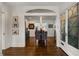Open-concept dining room featuring hardwood floors and modern chandelier at 166 Erie Ave, Decatur, GA 30030