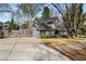 Charming exterior view of the home showing the driveway, front yard, and architectural details at 166 Erie Ave, Decatur, GA 30030