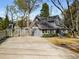 Charming exterior view of the home showing the driveway, front yard, and architectural details at 166 Erie Ave, Decatur, GA 30030