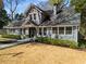 Charming two-story home with manicured front yard and welcoming entrance, offering classic design and curb appeal at 166 Erie Ave, Decatur, GA 30030