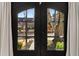 A charming view through double front doors revealing a well-maintained front yard and inviting neighborhood at 166 Erie Ave, Decatur, GA 30030
