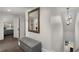 Hallway featuring neutral walls, carpeting, a storage bench, and doorways to other rooms at 166 Erie Ave, Decatur, GA 30030
