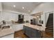 Modern kitchen featuring granite countertops, stainless appliances and breakfast bar at 166 Erie Ave, Decatur, GA 30030