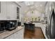 Bright, open kitchen with island, granite countertops, stainless appliances and hardwood floors at 166 Erie Ave, Decatur, GA 30030