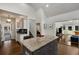 Open kitchen with island, granite countertops and hardwood floors at 166 Erie Ave, Decatur, GA 30030
