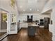 Spacious, bright kitchen with stainless steel appliances, island, and white cabinets at 166 Erie Ave, Decatur, GA 30030